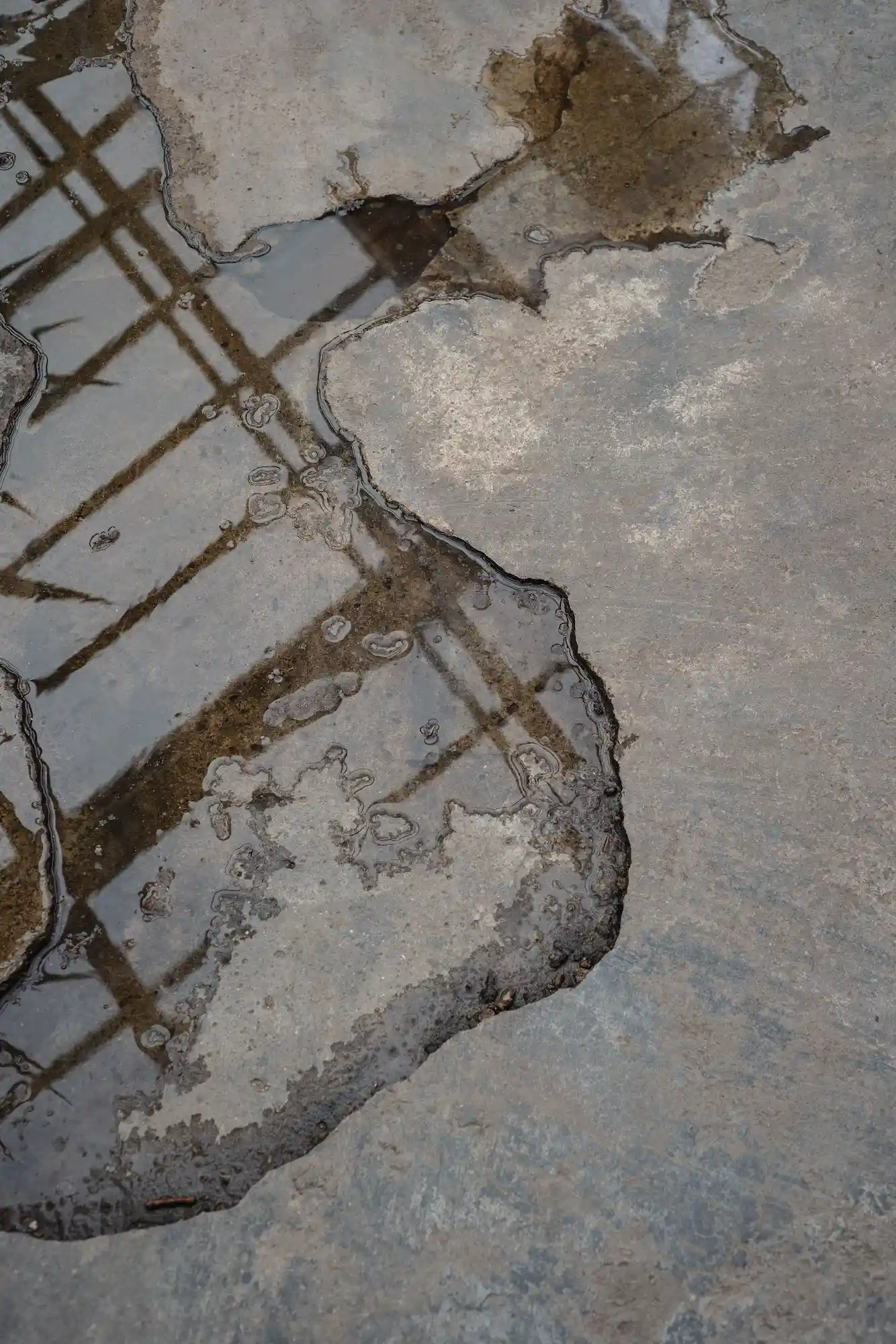 Leaking water pooling on a basement floor