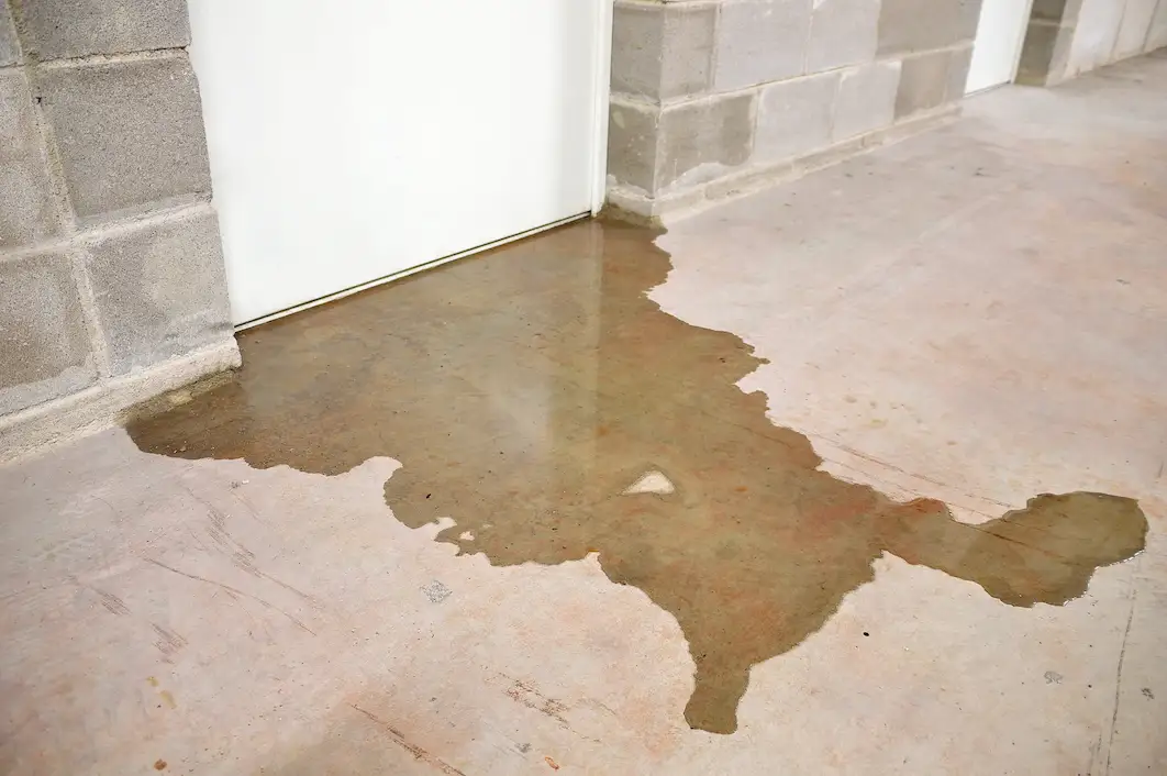 water damage leaking out of a room in a commercial building